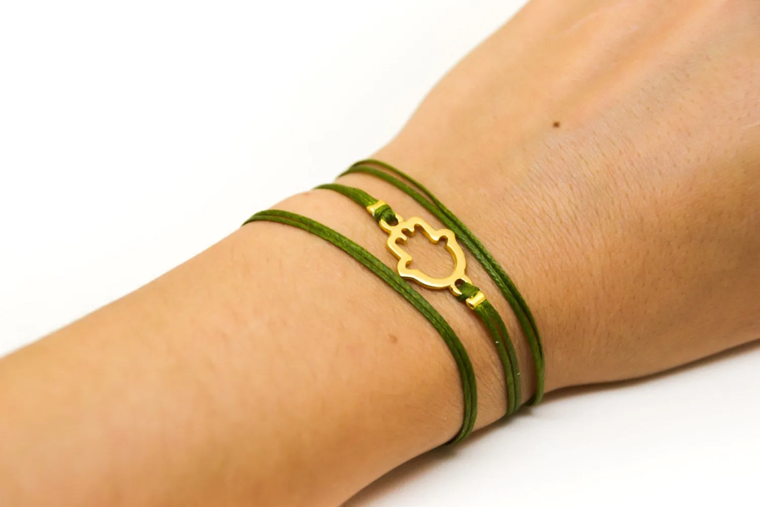 Wrapped green cord bracelet with gold Hamsa charm